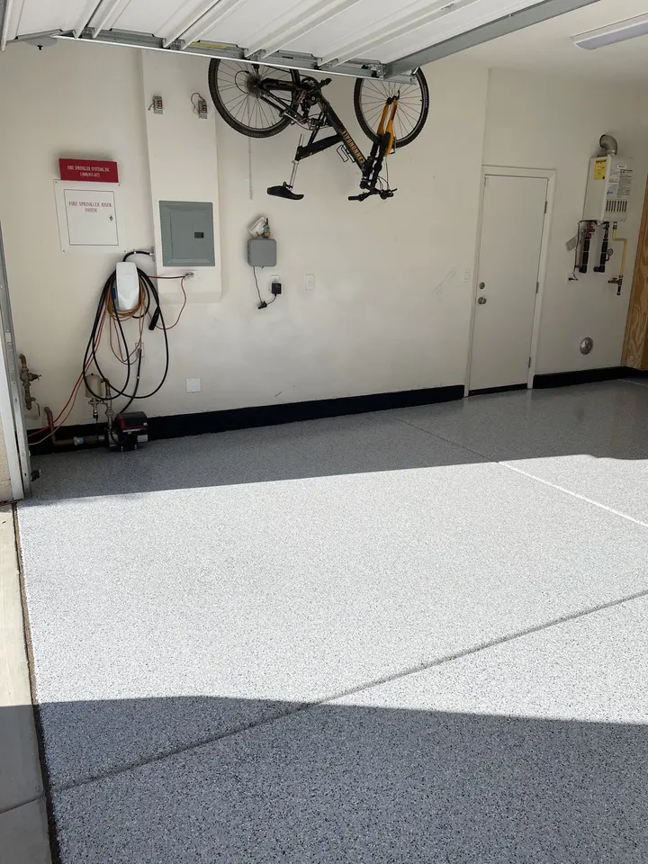 Flake garage floor with the door open and afternoon light